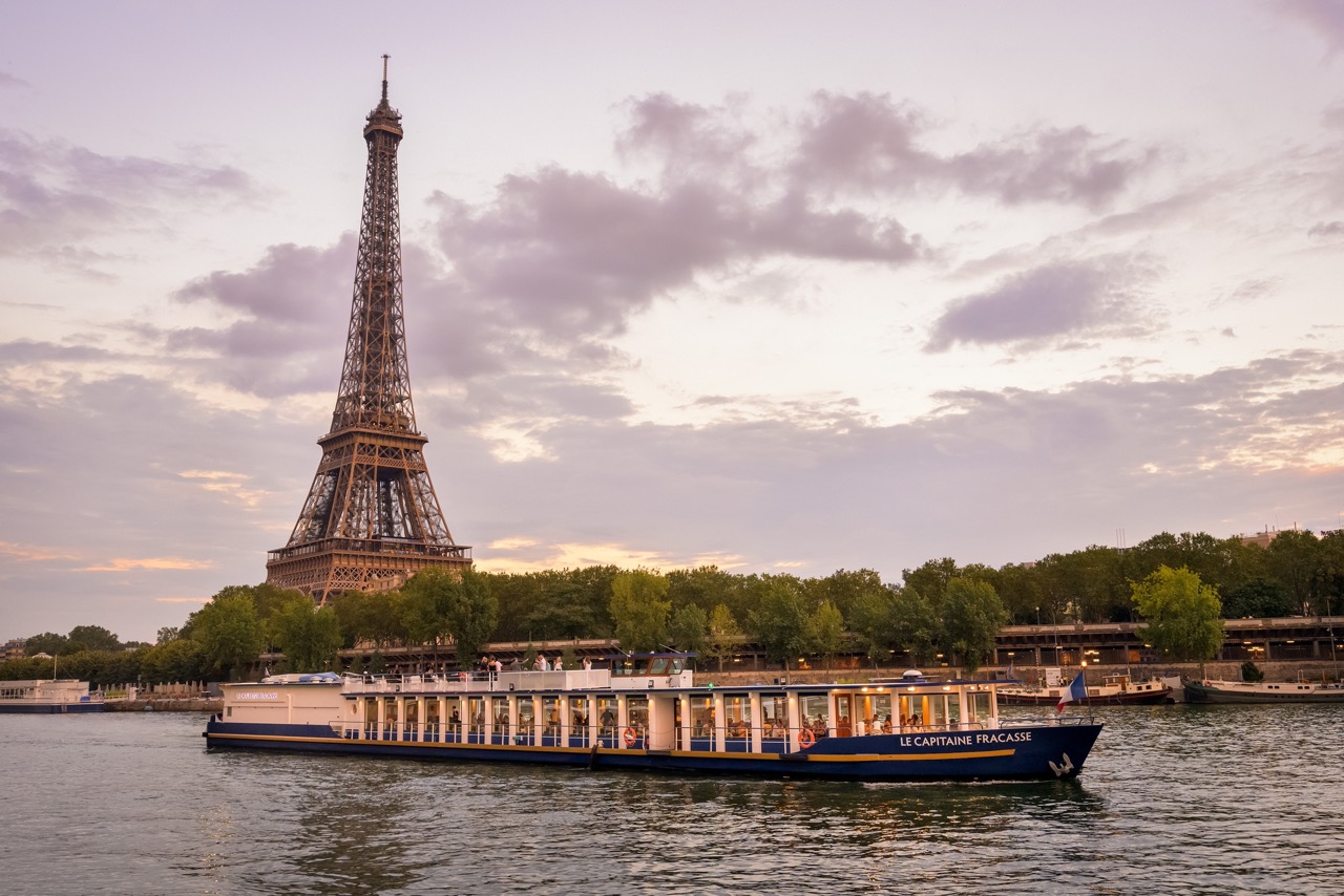 cruise boat on the river seine with the eiffel tower on the background