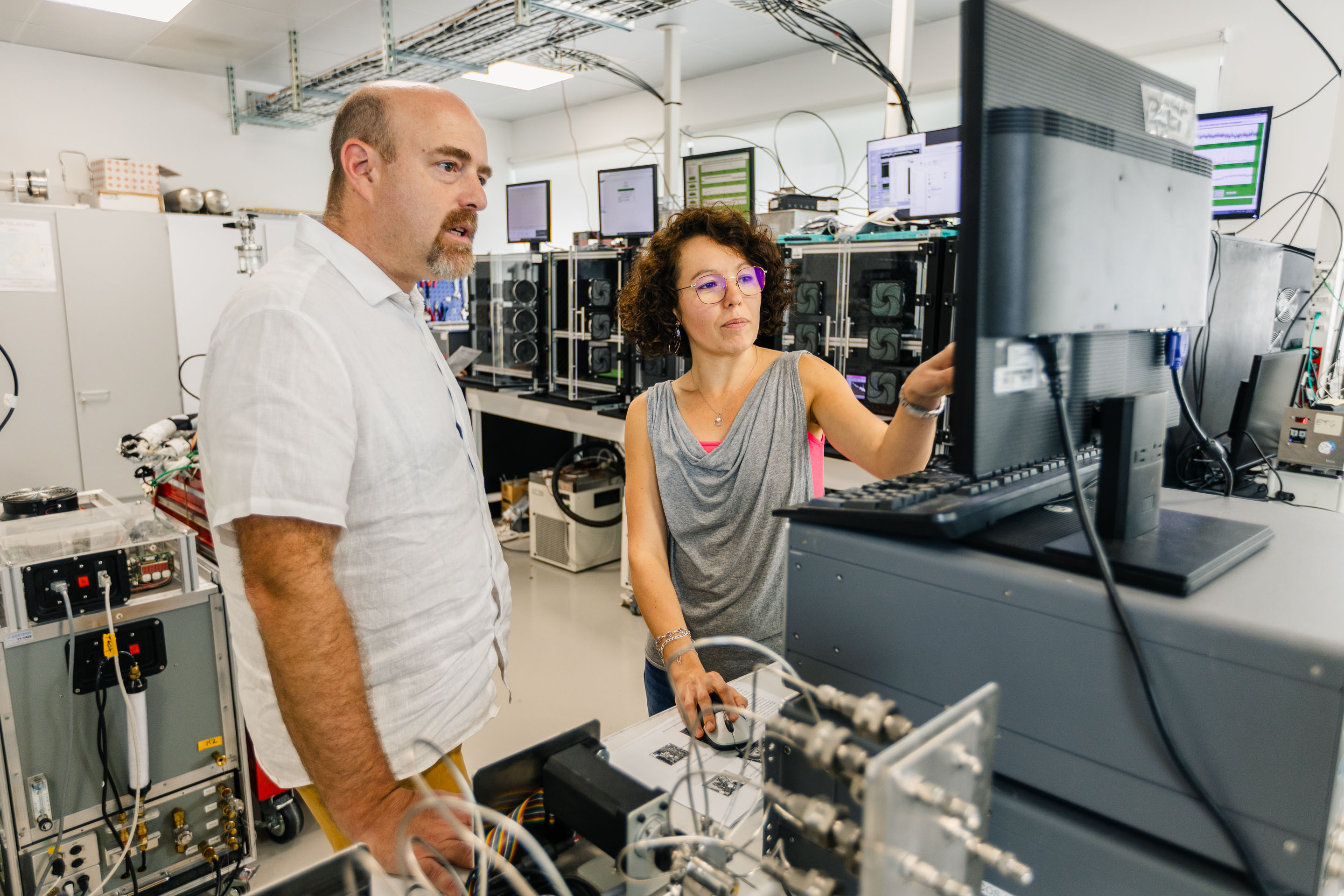 Scientists looking at monitor