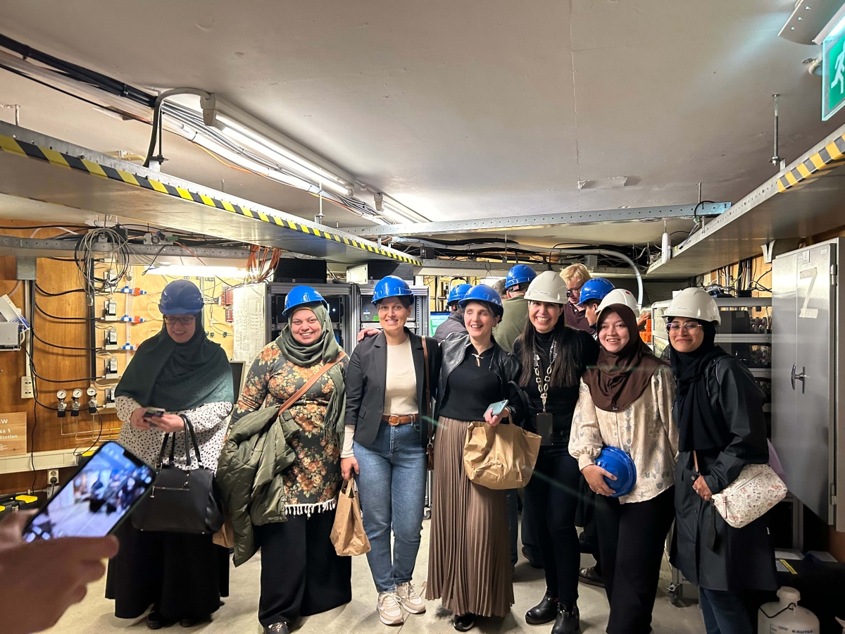 Smiling attendees during station lab tour